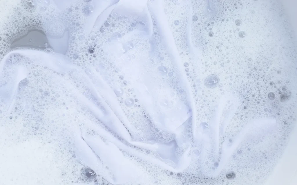 Hotel laundry with professional cleaning products for textiles and bed linen